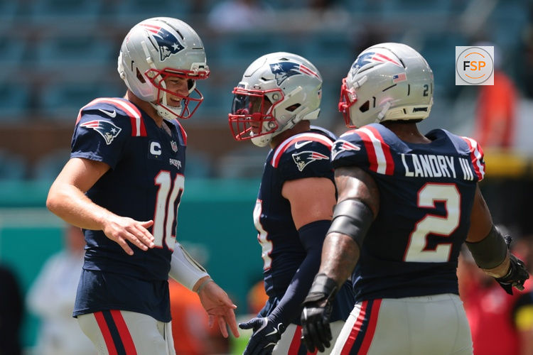 Sep 14, 2025; Miami Gardens, Florida, USA; New England Patriots quarterback Drake Maye (10) and New England Patriots linebacker Harold Landry III (2) shake hands before the game against the Miami Dolphins at Hard Rock Stadium. Credit: Sam Navarro-Imagn Images
