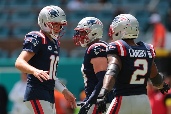 Sep 14, 2025; Miami Gardens, Florida, USA; New England Patriots quarterback Drake Maye (10) and New England Patriots linebacker Harold Landry III (2) shake hands before the game against the Miami Dolphins at Hard Rock Stadium. Mandatory Credit: Sam Navarro-Imagn Images