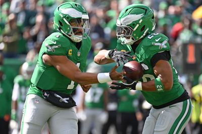Oct 26, 2025; Philadelphia, Pennsylvania, USA; Philadelphia Eagles quarterback Jalen Hurts (1) hands off to running back Saquon Barkley (26) against the New York Giants at Lincoln Financial Field. Mandatory Credit: Eric Hartline-Imagn Images