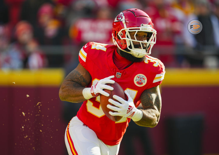 Nov 29, 2024; Kansas City, Missouri, USA; Kansas City Chiefs running back Samaje Perine (34) returns a kickoff during the first half against the Las Vegas Raiders at GEHA Field at Arrowhead Stadium. Credit: Jay Biggerstaff-Imagn Images