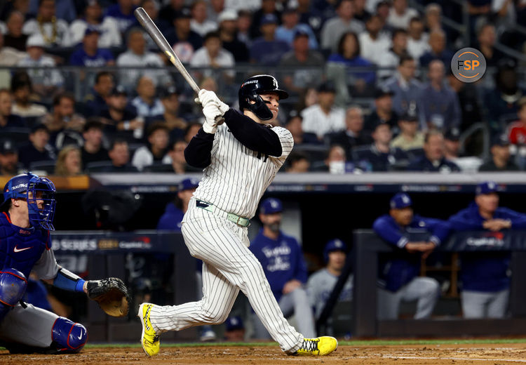 Oct 30, 2024; New York, New York, USA; New York Yankees outfielder Alex Verdugo (24) hits a RBI single during the second inning against the Los Angeles Dodgers in game five of the 2024 MLB World Series at Yankee Stadium. Credit: Vincent Carchietta-Imagn Images
