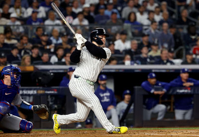 Oct 30, 2024; New York, New York, USA; New York Yankees outfielder Alex Verdugo (24) hits a RBI single during the second inning against the Los Angeles Dodgers in game five of the 2024 MLB World Series at Yankee Stadium. Mandatory Credit: Vincent Carchietta-Imagn Images