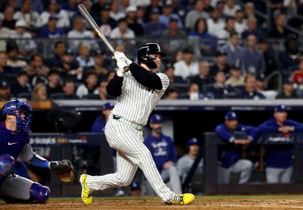 Oct 30, 2024; New York, New York, USA; New York Yankees outfielder Alex Verdugo (24) hits a RBI single during the second inning against the Los Angeles Dodgers in game five of the 2024 MLB World Series at Yankee Stadium. Mandatory Credit: Vincent Carchietta-Imagn Images
