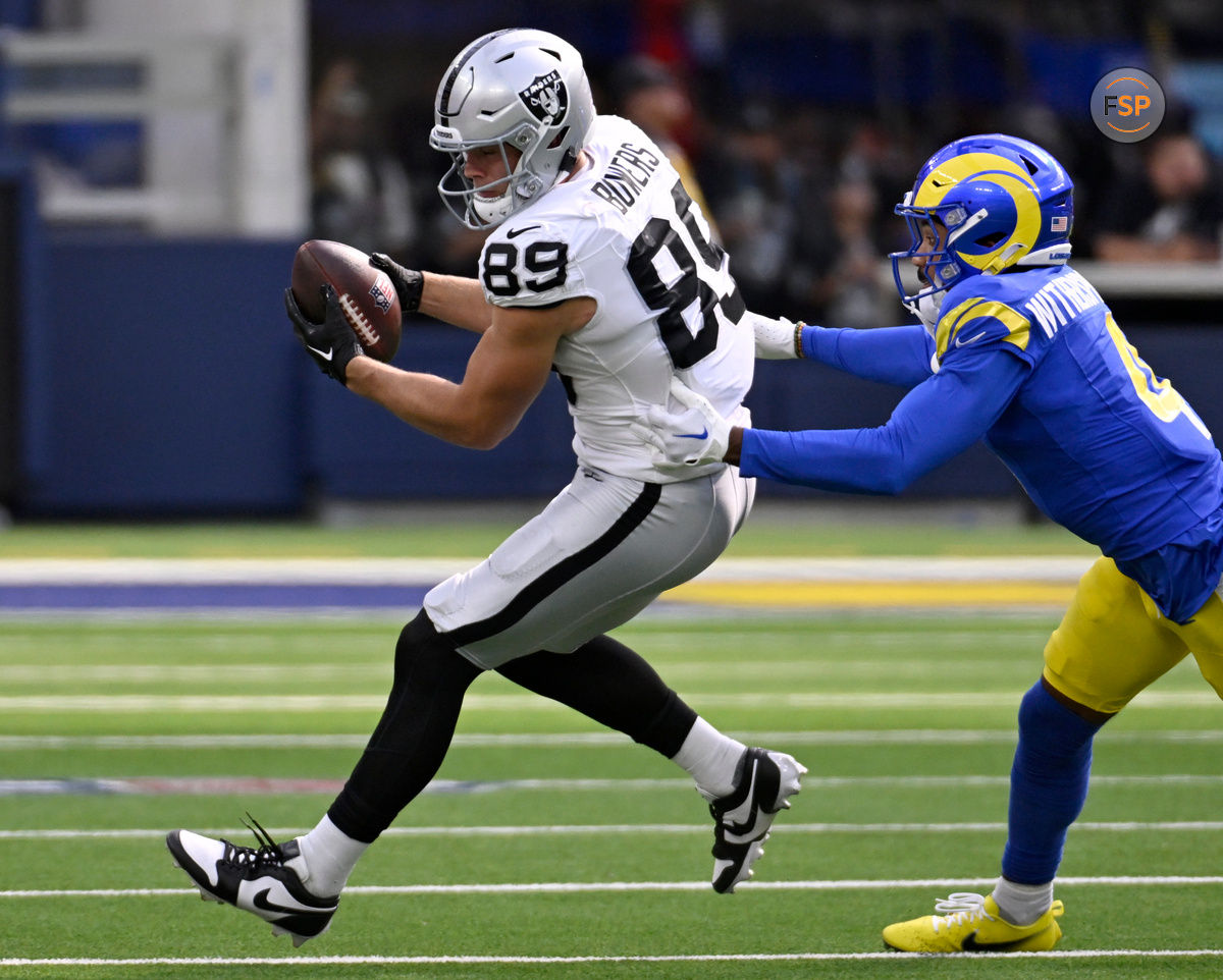 Oct 20, 2024; Inglewood, California, USA; Las Vegas Raiders tight end Brock Bowers (89) catches a pass against Los Angeles Rams cornerback Ahkello Witherspoon (4) in the first half at SoFi Stadium. Credit: Alex Gallardo-Imagn Images