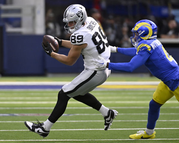 Oct 20, 2024; Inglewood, California, USA; Las Vegas Raiders tight end Brock Bowers (89) catches a pass against Los Angeles Rams cornerback Ahkello Witherspoon (4) in the first half at SoFi Stadium. Mandatory Credit: Alex Gallardo-Imagn Images