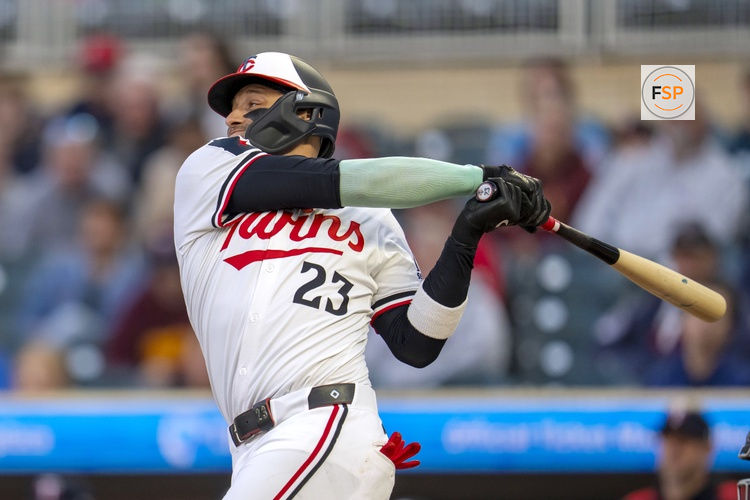 Sep 3, 2025; Minneapolis, Minnesota, USA; Minnesota Twins third baseman Royce Lewis (23) hits a single against the Chicago White Sox in the second inning at Target Field. Credit: Jesse Johnson-Imagn Images