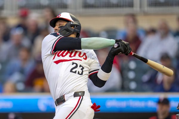Sep 3, 2025; Minneapolis, Minnesota, USA; Minnesota Twins third baseman Royce Lewis (23) hits a single against the Chicago White Sox in the second inning at Target Field. Mandatory Credit: Jesse Johnson-Imagn Images