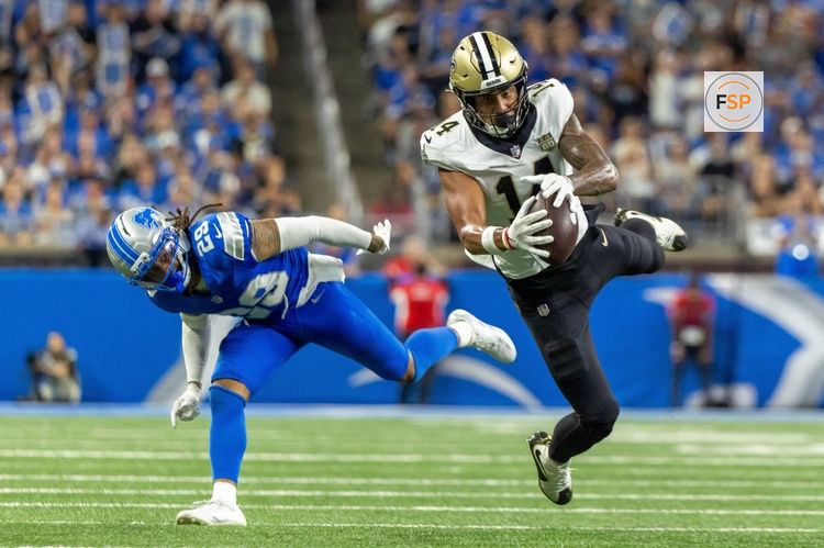 Sep 13, 2026; Detroit, Michigan, USA;  New Orleans Saints wide receiver Devaughn Vele (14) makes a reception in front of Detroit Lions defensive back Avonte Maddox (29) during the fourth quarter at Ford Field.  Credit: David Reginek-Imagn Images