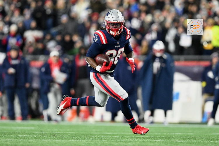 Jan 4, 2026; Foxborough, Massachusetts, USA; New England Patriots running back Rhamondre Stevenson (38) runs the ball against the Miami Dolphins during the fourth quarter at Gillette Stadium. Credit: Brian Fluharty-Imagn Images