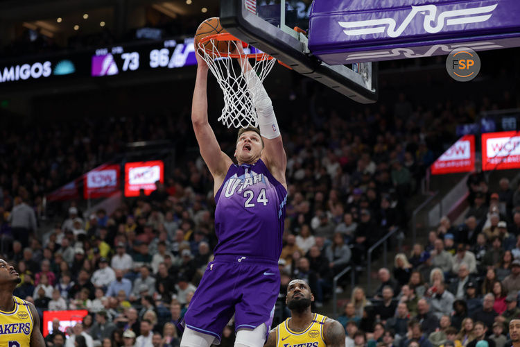 Feb 12, 2025; Salt Lake City, Utah, USA;  Utah Jazz center Walker Kessler (24) dunks against Los Angeles Lakers forward Lebron James (23) during the second half at Delta Center. Credit: Chris Nicoll-Imagn Images