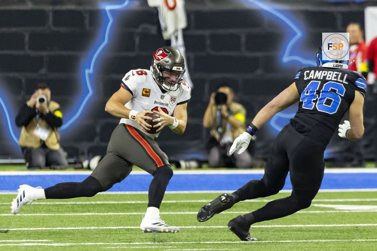 Oct 20, 2025; Detroit, Michigan, USA; Tampa Bay Buccaneers quarterback Baker Mayfield (6) rushes the ball against Detroit Lions linebacker Jack Campbell (46) during the first half at Ford Field. Credit: David Reginek-Imagn Images