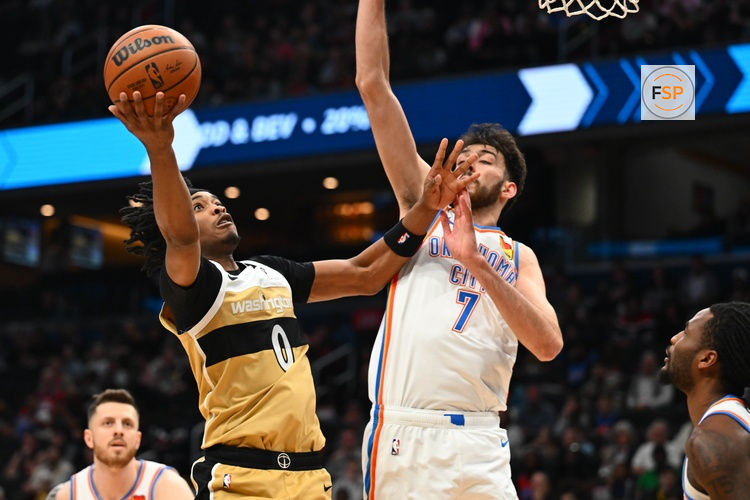 Mar 21, 2026; Washington, District of Columbia, USA; Washington Wizards guard Bilal Coulibaly (0) shoots over Oklahoma City Thunder center/forward Chet Holmgren (7) during the first half at Capital One Arena. Credit: Brad Mills-Imagn Images