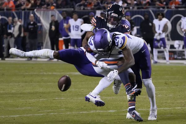 Sep 8, 2025; Chicago, Illinois, USA; Minnesota Vikings safety Jay Ward (24) knocks the ball from Chicago Bears wide receiver DJ Moore (2) during the second half at Soldier Field. Mandatory Credit: David Banks-Imagn Images