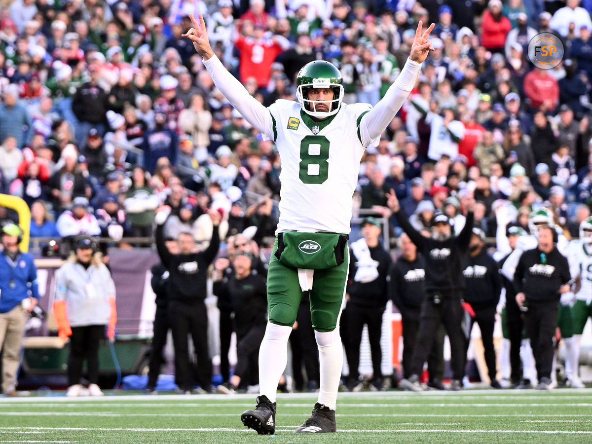 Oct 27, 2024; Foxborough, Massachusetts, USA; New York Jets quarterback Aaron Rodgers (8) reacts after throwing for a touchdown against the New England Patriots during the second half at Gillette Stadium. Credit: Brian Fluharty-Imagn Images