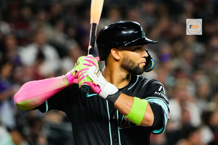 Aug 9, 2025; Phoenix, Arizona, USA; Arizona Diamondbacks outfielder Lourdes Gurriel Jr. (12) at bat in the seventh inning of the game between the Arizona Diamondbacks and Colorado Rockies at Chase Field. Credit: Arianna Grainey-Imagn Images