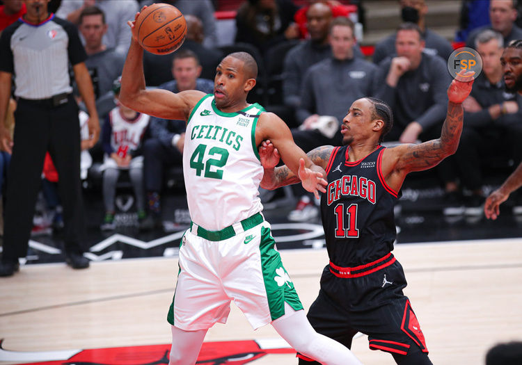 CHICAGO, IL - APRIL 06: Chicago Bulls forward DeMar DeRozan (11) guards Boston Celtics center Al Horford (42) during a NBA game between the Boston Celtics and the Chicago Bulls on April 6, 2022 at the United Center in Chicago, IL. (Photo by Melissa Tamez/Icon Sportswire)