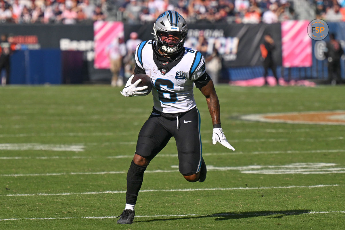 Oct 6, 2024; Chicago, Illinois, USA; Carolina Panthers running back Miles Sanders (6) runs after a catch against the Chicago Bears during the fourth quarter at Soldier Field. Credit: Daniel Bartel-Imagn Images