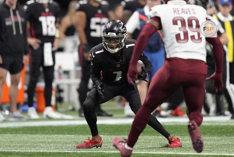 Sep 28, 2025; Atlanta, Georgia, USA; Atlanta Falcons wide receiver Darnell Mooney (1) runs against Washington Commanders safety Jeremy Reaves (39) during the first half at Mercedes-Benz Stadium. Credit: Dale Zanine-Imagn Images