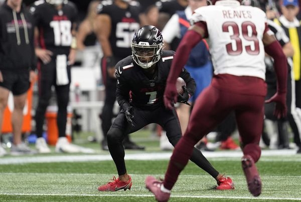 Sep 28, 2025; Atlanta, Georgia, USA; Atlanta Falcons wide receiver Darnell Mooney (1) runs against Washington Commanders safety Jeremy Reaves (39) during the first half at Mercedes-Benz Stadium. Mandatory Credit: Dale Zanine-Imagn Images