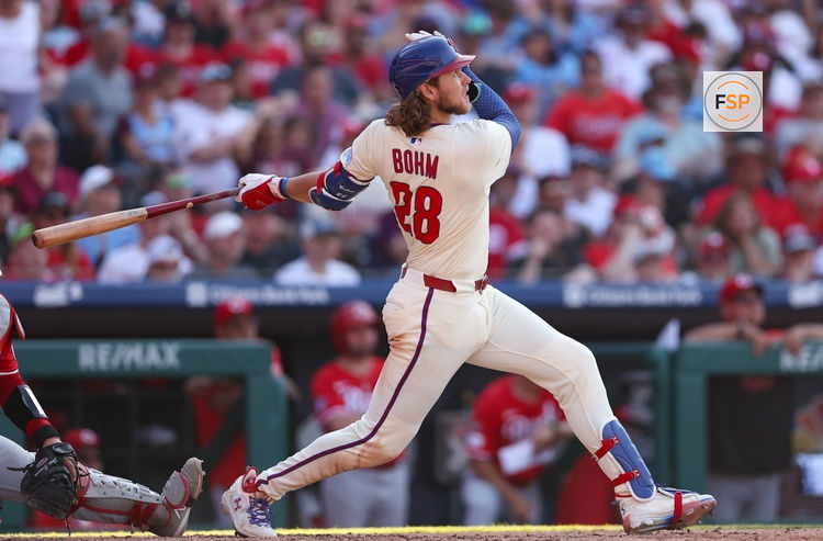 Jul 5, 2025; Philadelphia, Pennsylvania, USA; Philadelphia Phillies third base Alec Bohm (28) hits a two RBI home run during the sixth inning against the Cincinnati Reds at Citizens Bank Park. Credit: Bill Streicher-Imagn Images