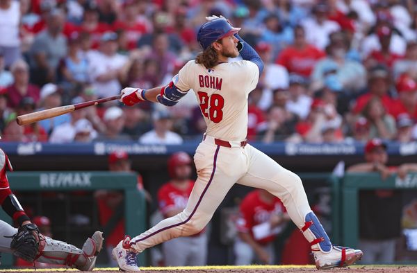 Jul 5, 2025; Philadelphia, Pennsylvania, USA; Philadelphia Phillies third base Alec Bohm (28) hits a two RBI home run during the sixth inning against the Cincinnati Reds at Citizens Bank Park. Mandatory Credit: Bill Streicher-Imagn Images