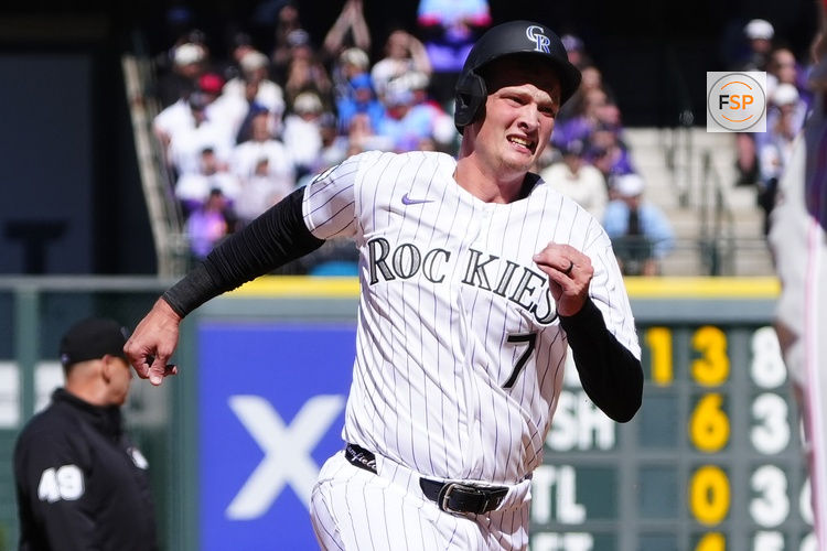 Apr 3, 2026; Denver, Colorado, USA; Colorado Rockies first baseman TJ Rumfield (7) heads to third in the first inning against the Philadelphia Phillies at Coors Field. Credit: Ron Chenoy-Imagn Images