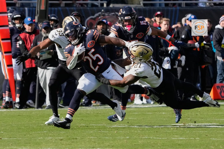 Oct 19, 2025; Chicago, Illinois, USA; New Orleans Saints safety Justin Reid (21) makes a diving tackle against Chicago Bears running back Kyle Monangai (25) during the second half at Soldier Field. Credit: David Banks-Imagn Images