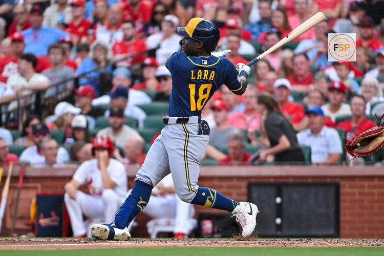 Jul 7, 2026; St. Louis, Missouri, USA; Milwaukee Brewers center fielder Luis Lara (18) hits a two run single in his Major League debut during the fifth inning against the St. Louis Cardinals at Busch Stadium. Credit: Jeff Curry-Imagn Images