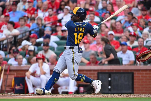 Jul 7, 2026; St. Louis, Missouri, USA; Milwaukee Brewers center fielder Luis Lara (18) hits a two run single in his Major League debut during the fifth inning against the St. Louis Cardinals at Busch Stadium. Mandatory Credit: Jeff Curry-Imagn Images
