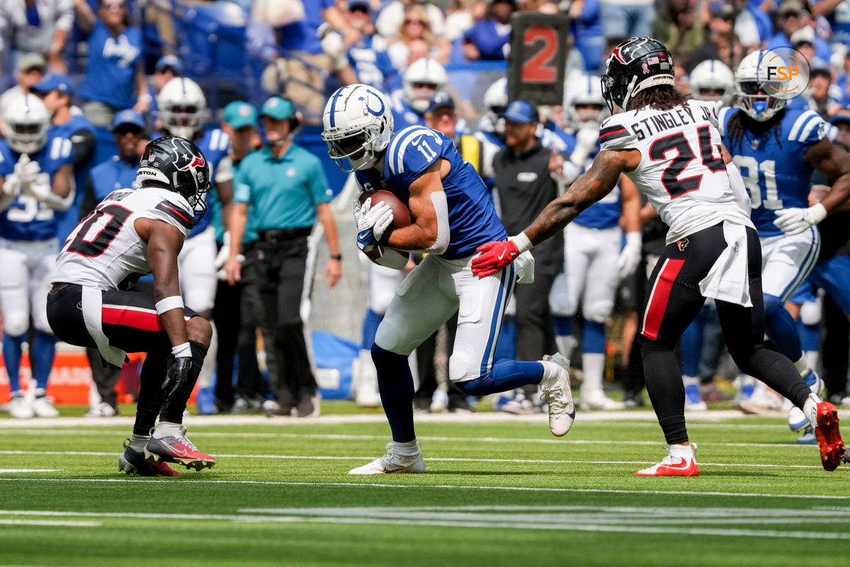 Sep 8, 2024; Indianapolis, Indiana, USA; Indianapolis Colts wide receiver Michael Pittman Jr. (11) looks to move past Houston Texans safety Jimmie Ward (20) and Houston Texans cornerback Derek Stingley Jr. (24) at Lucas Oil Stadium. Credit: Christine Tannous-USA TODAY Network via Imagn Images