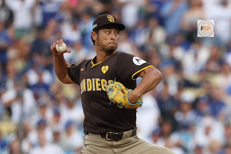 Oct 11, 2024; Los Angeles, California, USA; San Diego Padres pitcher Yu Darvish (11) pitches against the Los Angeles Dodgers in the first inning during game five of the NLDS for the 2024 MLB Playoffs at Dodger Stadium. Credit: Kiyoshi Mio-Imagn Images