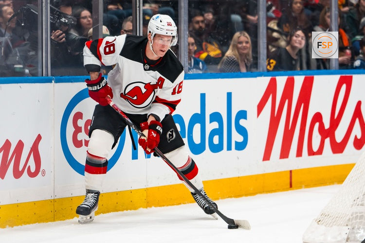 Jan 23, 2026; Vancouver, British Columbia, CAN; New Jersey Devils forward Ondrej Palat (18) handles the puck against the Vancouver Canucks in the first period at Rogers Arena. Credit: Bob Frid-Imagn Images