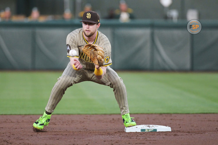 Apr 7, 2025; West Sacramento, California, USA; San Diego Padres first base Jake Cronenworth (9) catches the force out at second base during the first inning of the game against the Athletics at Sutter Health Park. Credit: Ed Szczepanski-Imagn Images