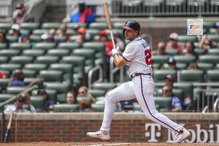 Apr 23, 2025; Cumberland, Georgia, USA; Atlanta Braves first base Matt Olson (28) singles against the St. Louis Cardinals during the eighth inning at Truist Park. Credit: Dale Zanine-Imagn Images