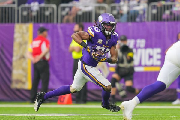 Nov 9, 2025; Minneapolis, Minnesota, USA; Minnesota Vikings running back Aaron Jones Sr. (33) runs with the ball against the Baltimore Ravens in the second quarter at U.S. Bank Stadium. Mandatory Credit: Brad Rempel-Imagn Images