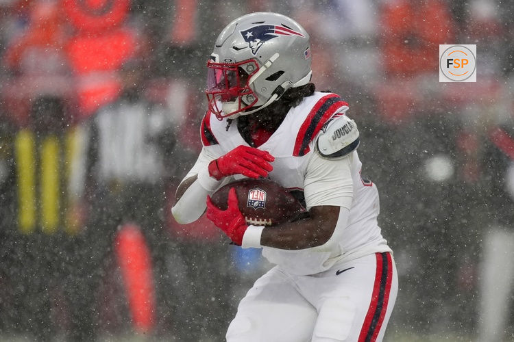 Jan 25, 2026; Denver, CO, USA; New England Patriots running back Rhamondre Stevenson (38) rushes the ball against the Denver Broncos during the second half in the 2026 AFC Championship Game at Empower Field at Mile High. Credit: Ron Chenoy-Imagn Images