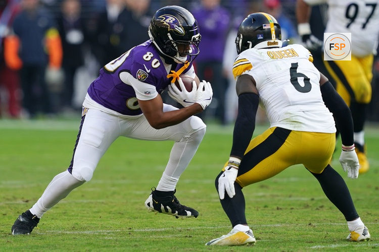 Dec 7, 2025; Baltimore, Maryland, USA; Baltimore Ravens tight end Isaiah Likely (80) runs with the ball against Pittsburgh Steelers linebacker Patrick Queen (6) during the first half at M&T Bank Stadium. Credit: Mitch Stringer-Imagn Images