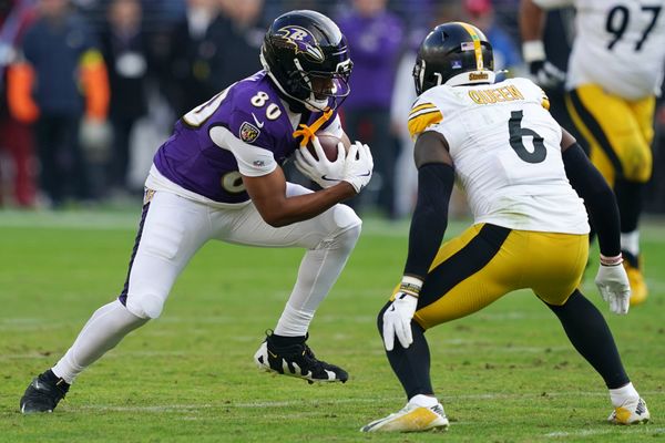 Dec 7, 2025; Baltimore, Maryland, USA; Baltimore Ravens tight end Isaiah Likely (80) runs with the ball against Pittsburgh Steelers linebacker Patrick Queen (6) during the first half at M&T Bank Stadium. Mandatory Credit: Mitch Stringer-Imagn Images
