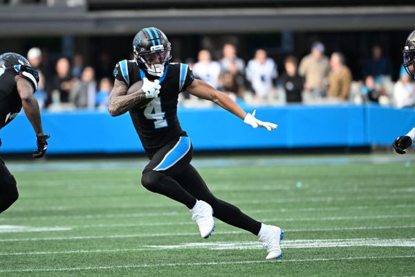 Dec 21, 2025; Charlotte, North Carolina, USA; Carolina Panthers wide receiver Tetairoa McMillan (4) with the ball in the third quarter at Bank of America Stadium. Mandatory Credit: Bob Donnan-Imagn Images