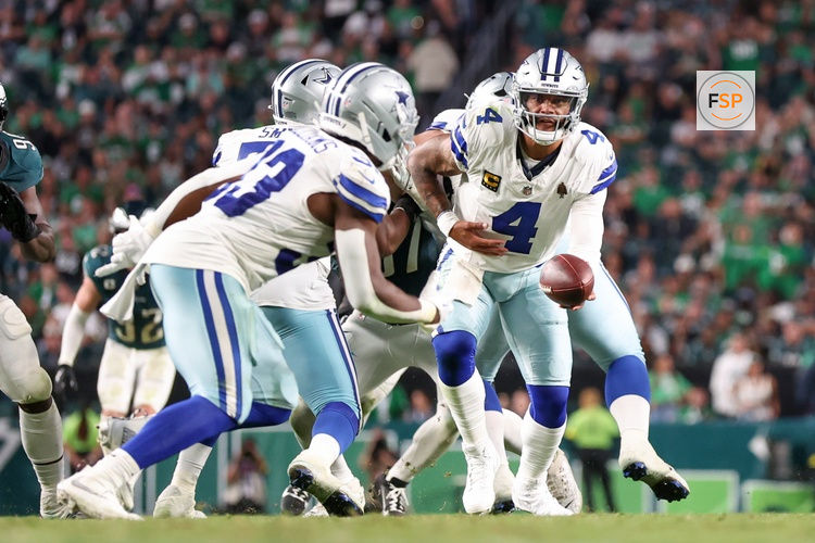 Sep 4, 2025; Philadelphia, Pennsylvania, USA; Dallas Cowboys quarterback Dak Prescott (4) hands the ball to running back Javonte Williams (33) against the Philadelphia Eagles during the fourth quarter of the game at Lincoln Financial Field. Credit: Bill Streicher-Imagn Images
