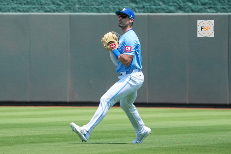 Jul 27, 2025; Kansas City, Missouri, USA; Kansas City Royals right fielder Randal Grichuk (15) fields a fly ball against the Cleveland Guardians during the first inning at Kauffman Stadium. Credit: Denny Medley-Imagn Images