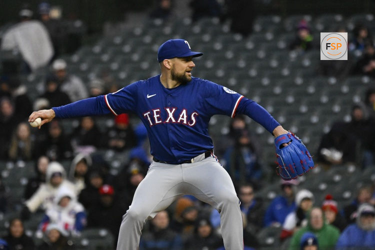 Apr 7, 2025; Chicago, Illinois, USA;  Texas Rangers pitcher Nathan Eovaldi (17) delivers against the Chicago Cubs during the first inning at Wrigley Field. Credit: Matt Marton-Imagn Images