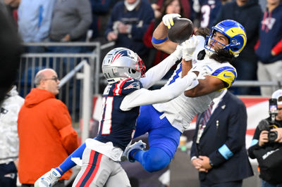 Nov 17, 2024; Foxborough, Massachusetts, USA;  New England Patriots cornerback Jonathan Jones (31) breaks up a pass to Los Angeles Rams wide receiver Puka Nacua (17) during the second half at Gillette Stadium. Mandatory Credit: Eric Canha-Imagn Images