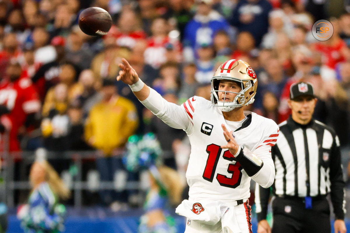 Oct 10, 2024; Seattle, Washington, USA; San Francisco 49ers quarterback Brock Purdy (13) passes against the Seattle Seahawks during the second quarter at Lumen Field. Credit: Joe Nicholson-Imagn Images