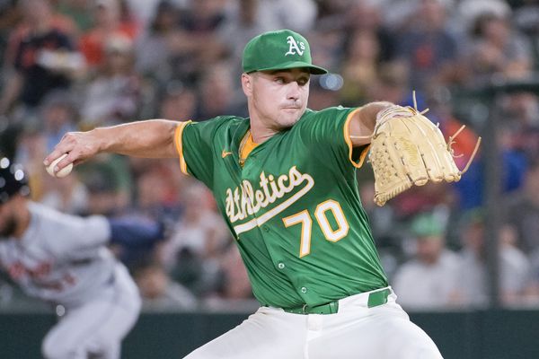Aug 25, 2025; West Sacramento, California, USA; Athletics pitcher J.T. Ginn (70) throws a pitch against the Detroit Tigers during the sixth inning at Sutter Health Park. Mandatory Credit: Ed Szczepanski-Imagn Images