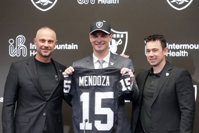 Apr 24, 2026; Henderson, NV, USA; Las Vegas Raiders quarterback Fernando Mendoza (center) poses with jersey with general manager John Spytek (left) and head coach Klint Kubiak  at introductory press conference at Intermountain Health Performance Center after being selected as the No. 1 pick in the 2026 NFL Draft. Mandatory Credit: Kirby Lee-Imagn Images