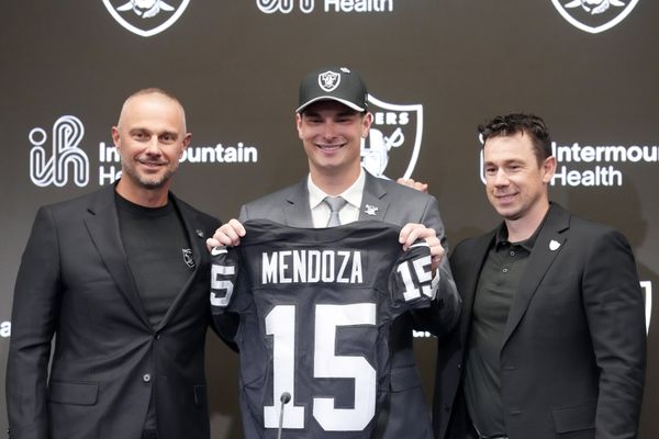 Apr 24, 2026; Henderson, NV, USA; Las Vegas Raiders quarterback Fernando Mendoza (center) poses with jersey with general manager John Spytek (left) and head coach Klint Kubiak  at introductory press conference at Intermountain Health Performance Center after being selected as the No. 1 pick in the 2026 NFL Draft. Mandatory Credit: Kirby Lee-Imagn Images