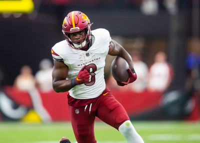 Sep 29, 2024; Glendale, Arizona, USA; Washington Commanders running back Brian Robinson Jr. (8) against the Arizona Cardinals at State Farm Stadium. Mandatory Credit: Mark J. Rebilas-Imagn Images