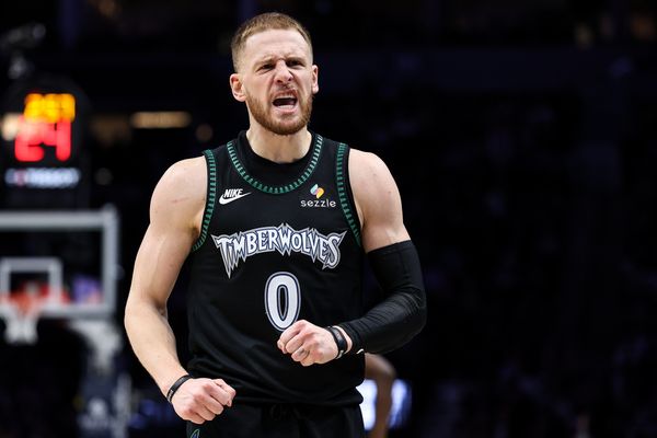 Nov 30, 2025; Minneapolis, Minnesota, USA; Minnesota Timberwolves guard Donte DiVincenzo (0) celebrates his three point basket against the San Antonio Spurs during the second half at Target Center. Mandatory Credit: Matt Krohn-Imagn Images