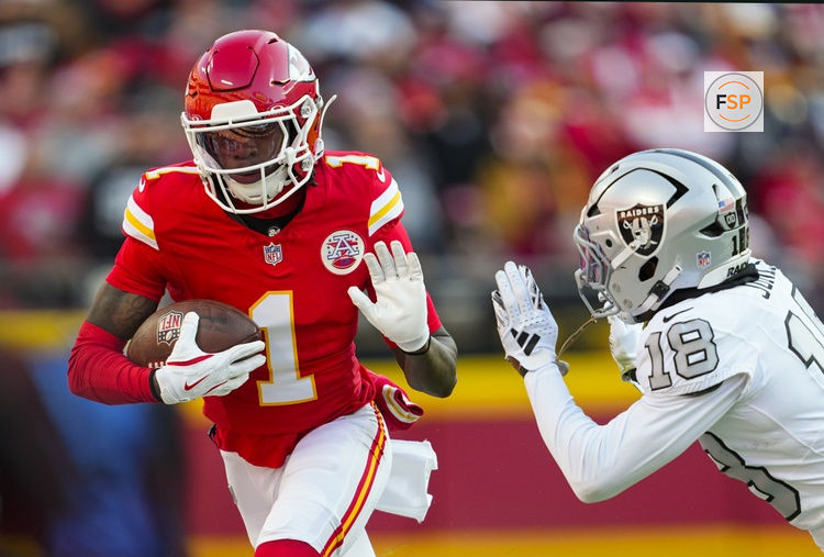 Nov 29, 2024; Kansas City, Missouri, USA; Kansas City Chiefs wide receiver Xavier Worthy (1) runs with the ball against Las Vegas Raiders cornerback Darnay Holmes (30) during the first half at GEHA Field at Arrowhead Stadium. Credit: Jay Biggerstaff-Imagn Images